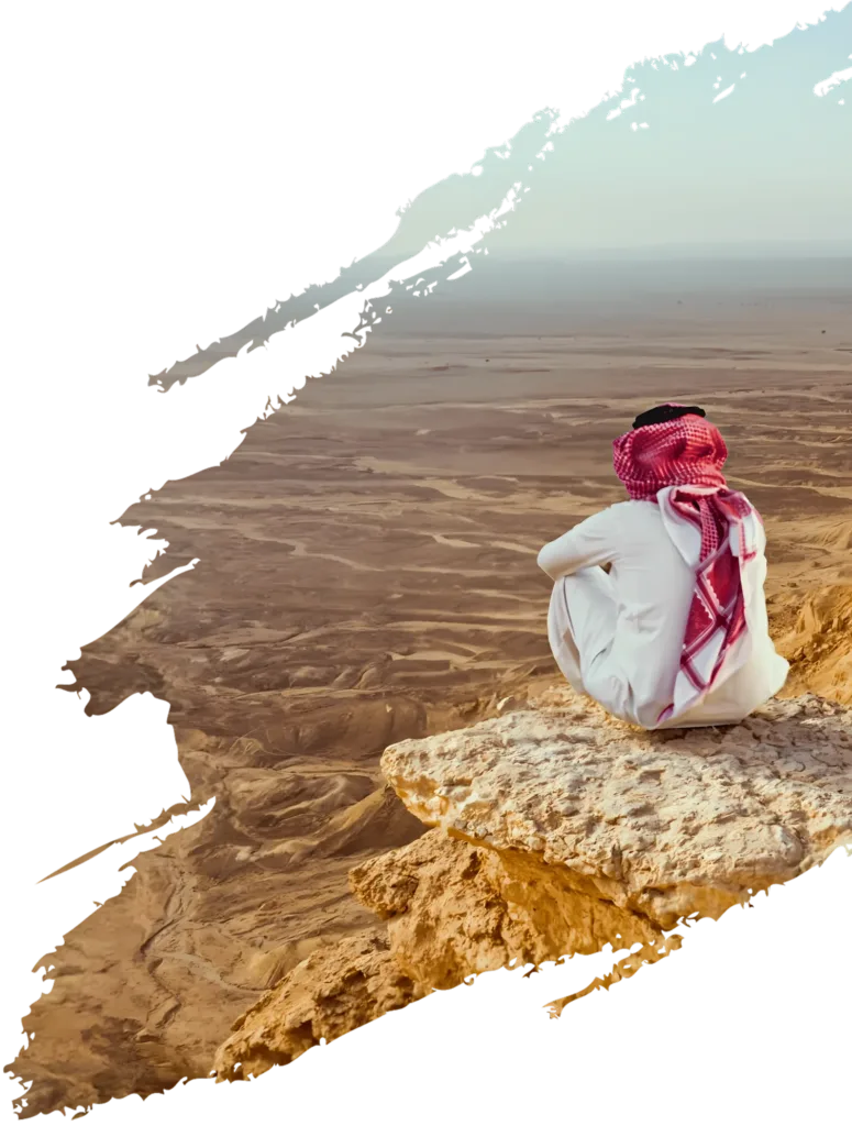 audi man sitting on a mountain, symbolizing Enso Arabia's vision of pushing the boundaries of possibility and disrupting the conferences industry in the Kingdom of Saudi Arabia and beyond
